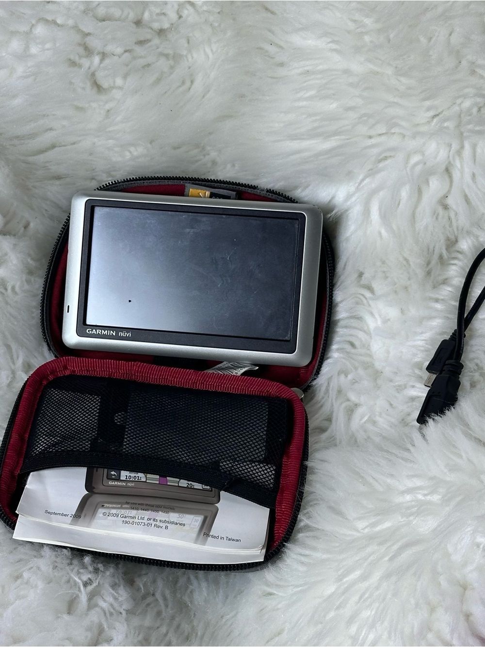 Garmin nuvi 1450 portable GPS navigator in silver with black bezel and red case
